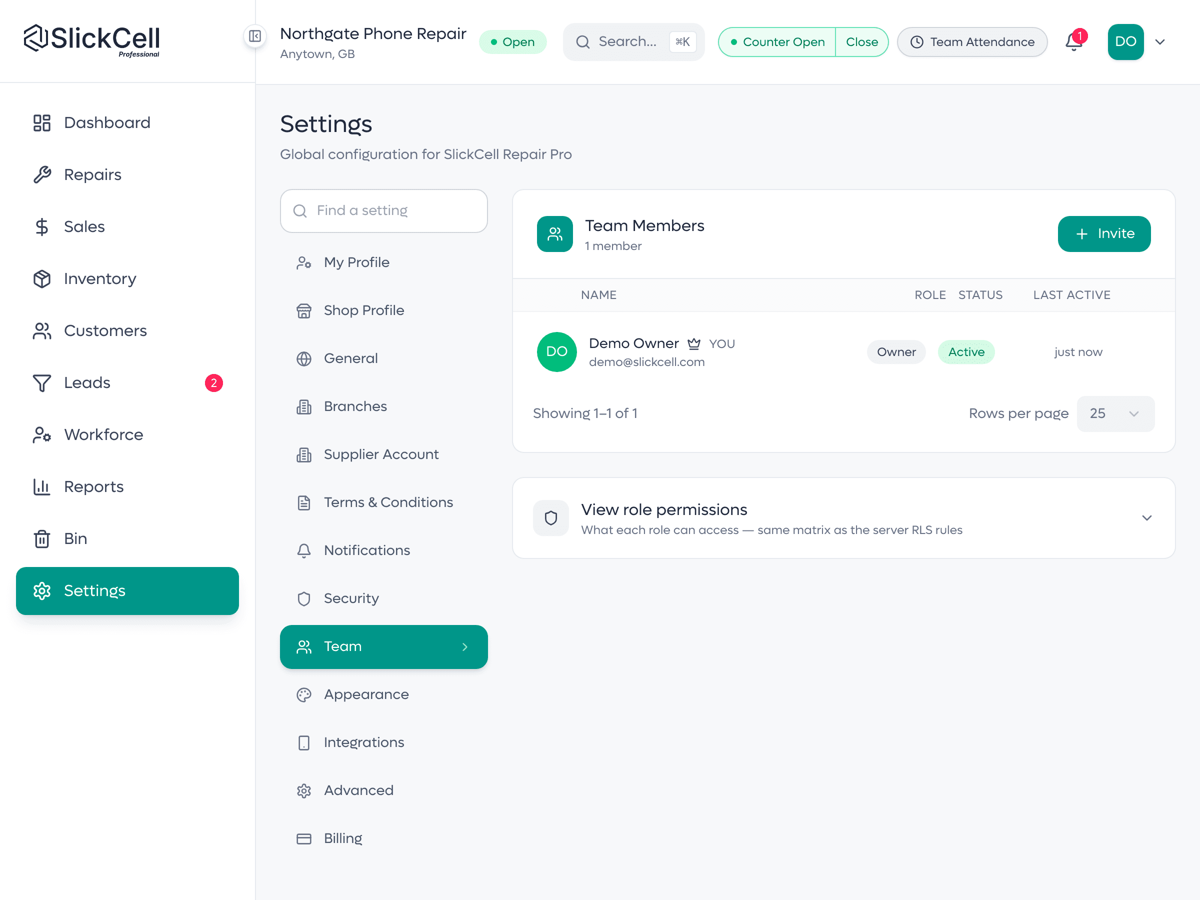 The team settings listing staff with their roles and the control to invite someone.
